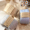 Rolls of light blue and gray cotton yarn for crafting