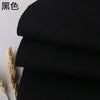 Black coarse linen and cotton fabric rolled up, showing texture.