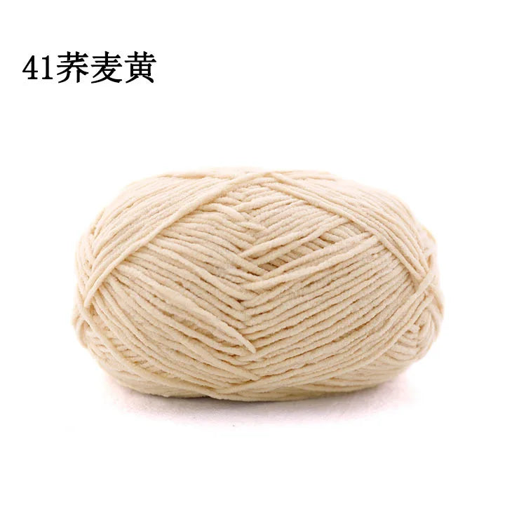 A ball of light beige matte chenille yarn for knitting and crochet