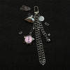 Silver chain keychain featuring a heart charm and a pink-faced pocket watch with a star shape.