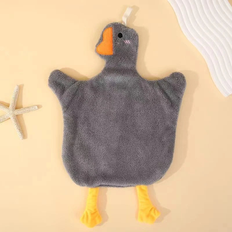 A gray cartoon goose hanging hand towel with orange beak and yellow feet.