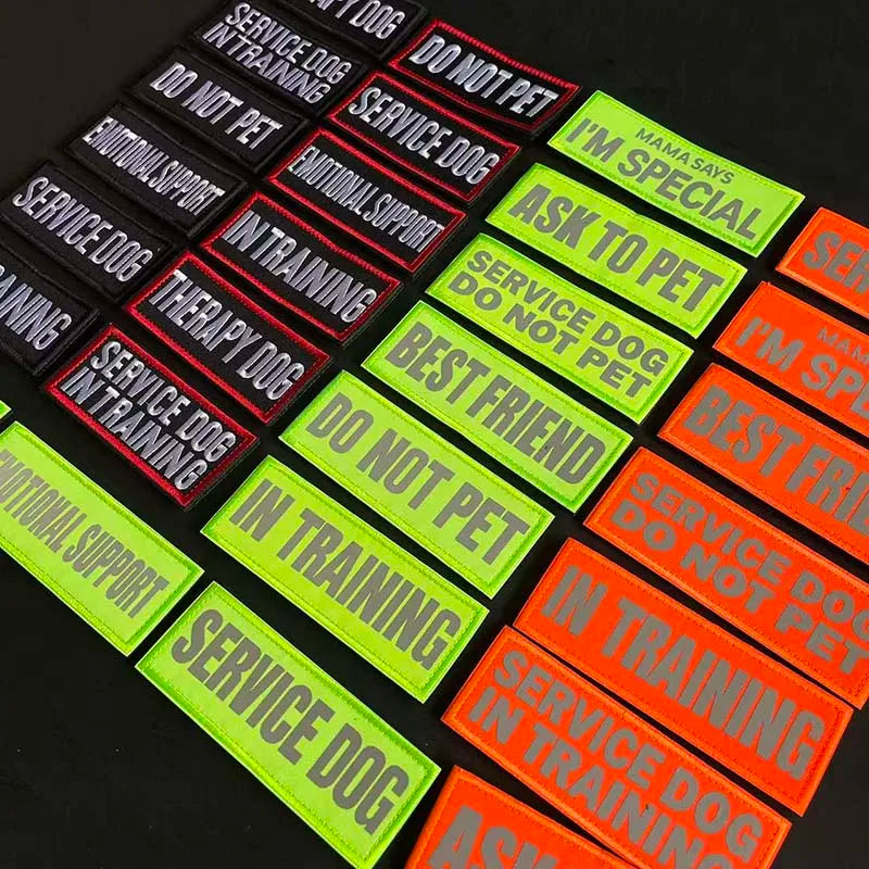 A collection of tactical embroidered dog training and service dog support patches in various colors like black, red, green, a