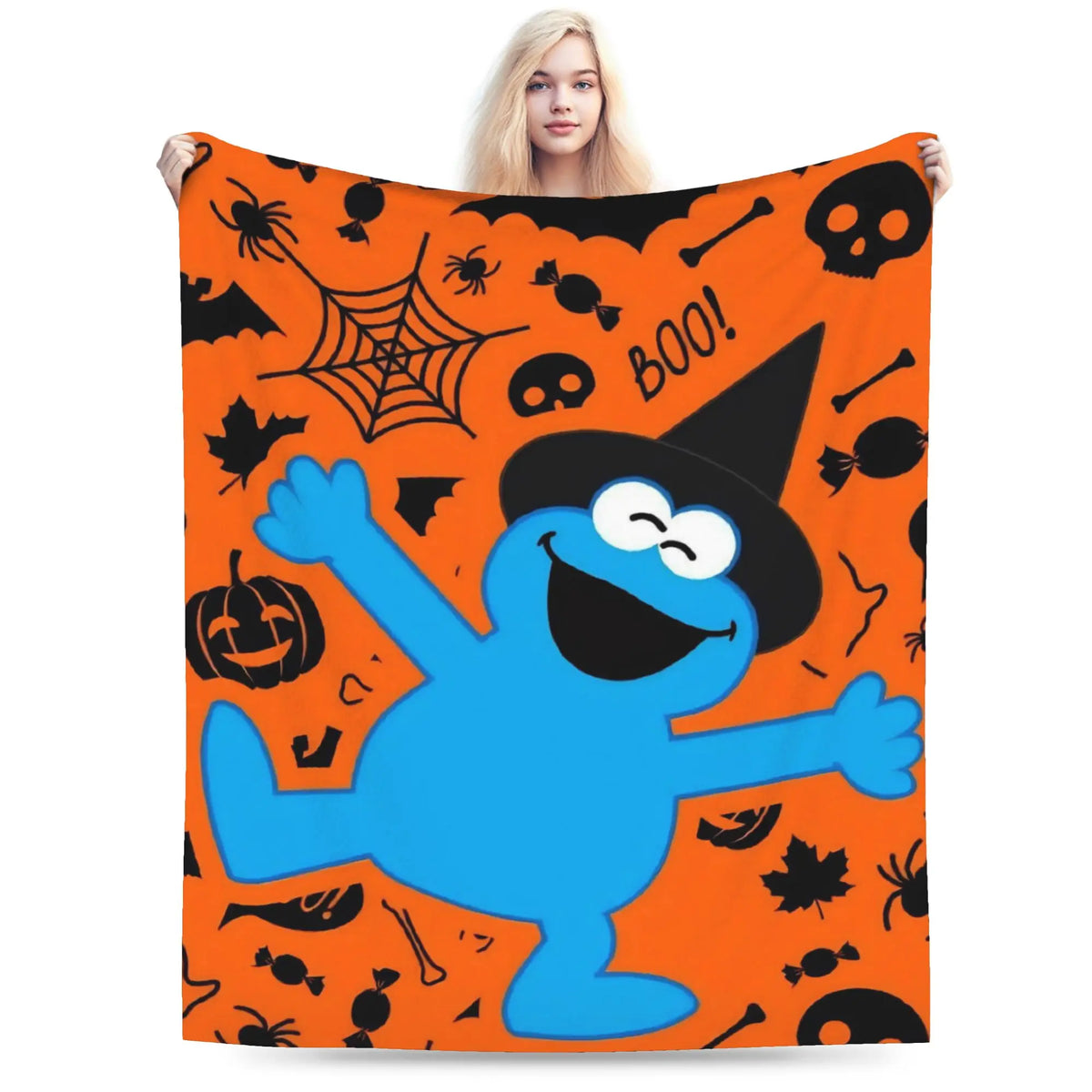 An orange cartoon featuring Elmo and friends on a blanket.