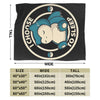 A black plush decorative throw blanket featuring a graphic of a baby sleeping inside a circular design.