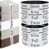 Set of four elastic bed sheet organizer straps in various colors and sizes for organizing bedding.