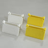Two plastic sewing guides, one white labeled 3 and another yellow labeled 4, are shown on a light surface.