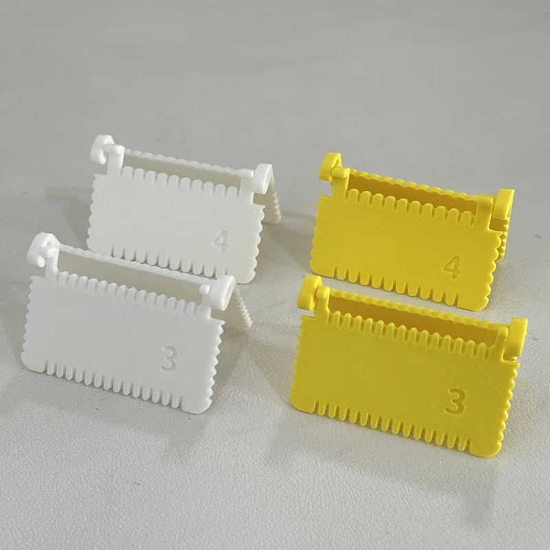 Two plastic sewing guides, one white labeled 3 and another yellow labeled 4, are shown on a light surface.