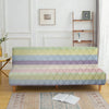A light blue and pink striped velvet sofa cover displayed on a wooden frame with a rug.