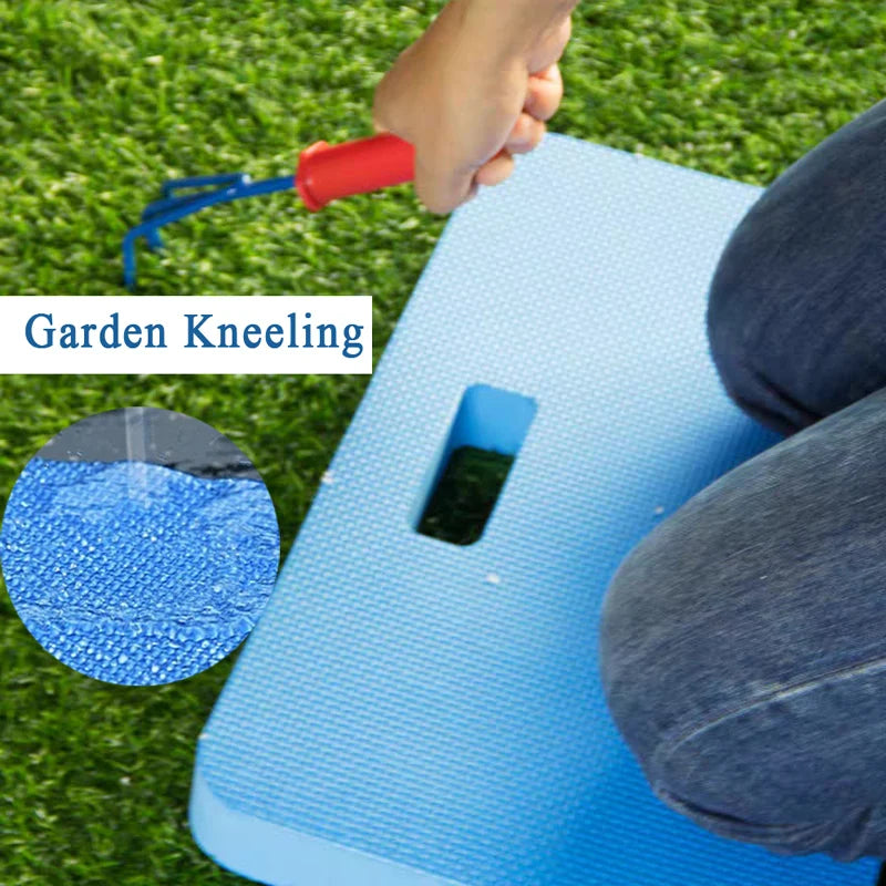 A hand is using a blue tool to knead a thick protective kneeling mat on green grass.