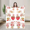 A white throw blanket featuring various strawberry shortcake themed plush animals and characters.