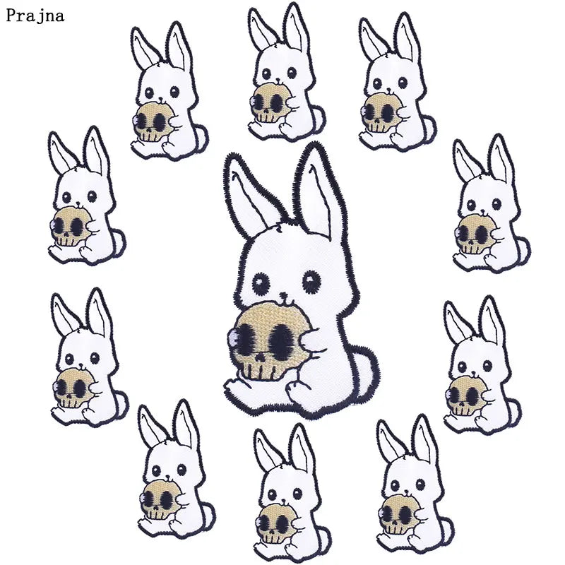 A collection of white embroidered bunny patches with gold accents for DIY punk embroidery on clothing.