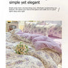 A double-sided floral printed bedding set in soft lavender and cream tones.