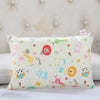 A light yellow cartoon style children's pillowcase featuring various colorful animal and character designs.
