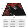A black and red graphic design featuring a skull and distressed text on a fleece throw blanket.