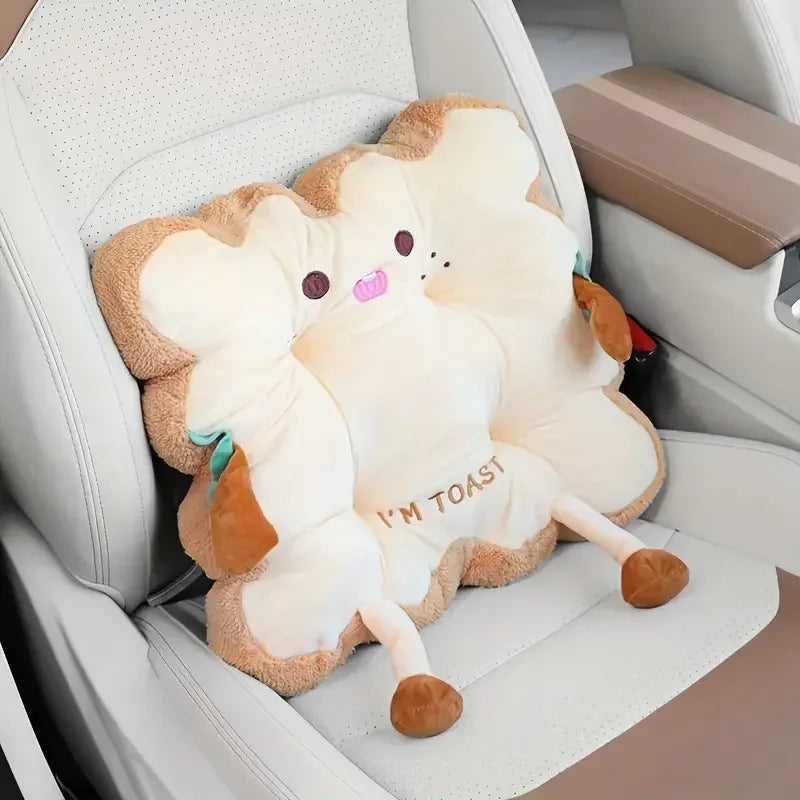 A plush cartoon toast shaped seat cushion for back and fatigue relief placed on a white car seat.