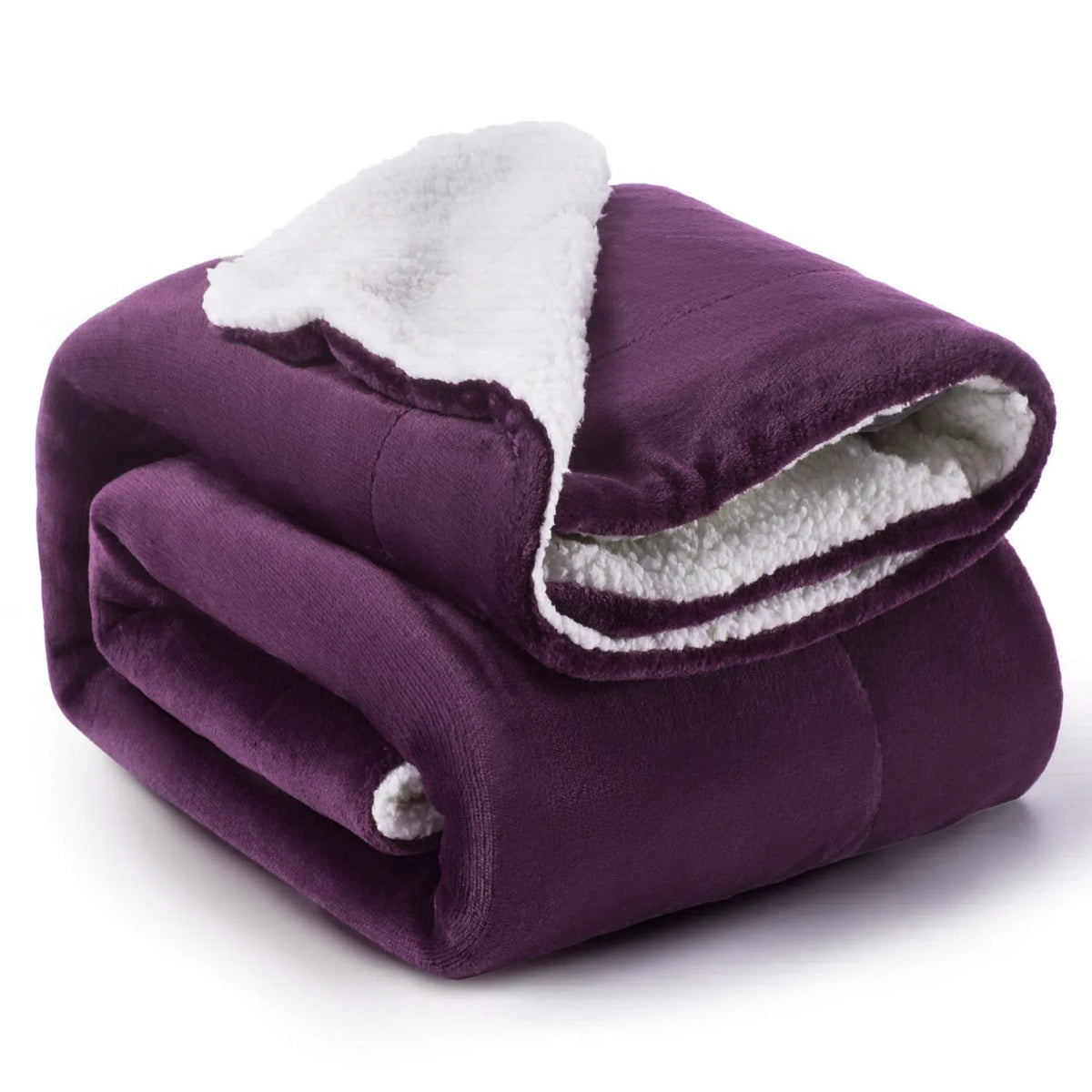 A deep purple sherpa fleece blanket rolled up, showing the soft white lining.
