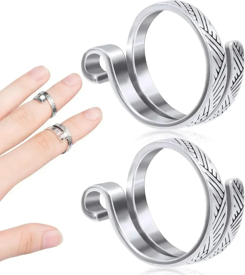 Silver adjustable crochet tension rings for knitting shown on a hand.