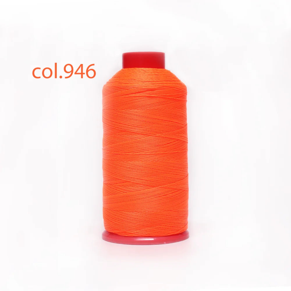 A spool of bright orange heavy duty nylon sewing thread labeled col.946.