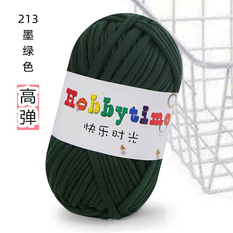A ball of dark green thick polyester craft yarn for knitting and crochet