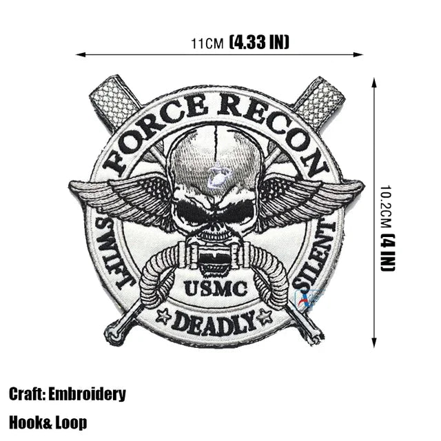 Embroidery design of a Force Recon USMC Deadly seal featuring a skull and crossed weapons.