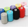 A collection of ten colored polyester sewing thread spools in various shades including blue, green, purple, yellow, pink, red