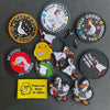 A collection of embroidered patches featuring various animals like geese and ducks with text such as Silly Goose on the Loose