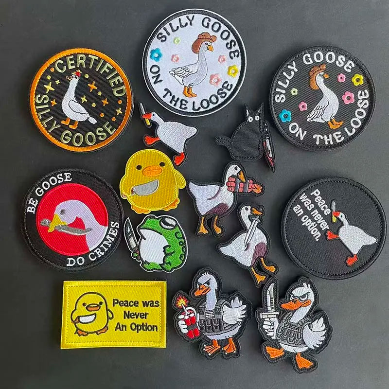 A collection of embroidered patches featuring various animals like geese and ducks with text such as Silly Goose on the Loose
