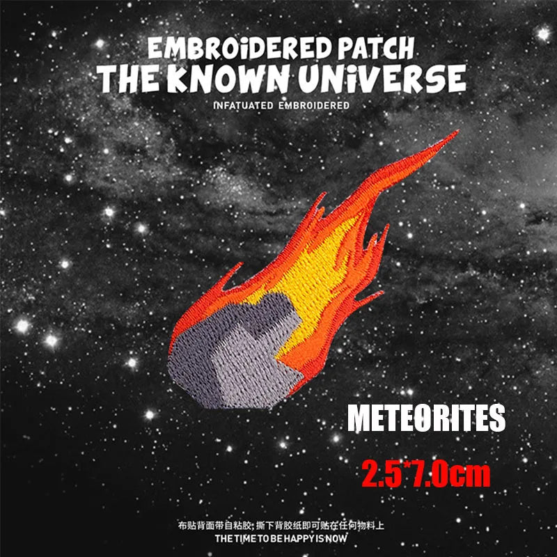 Embroidered patch featuring a fiery meteorite design on a dark background.