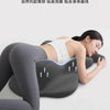 A woman is lying down using a gray ergonomic memory foam pillow for back and head support.