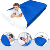 A child is lying on a white bed sheet covered by a bright blue breathable stretchy sensory bed sheet.