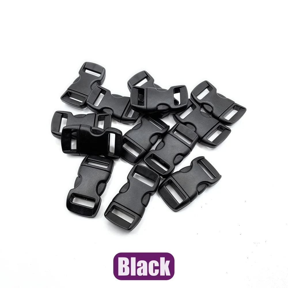 A pile of black adjustable plastic paracord buckle bracelets.