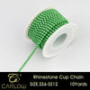 A spool of green glass rhinestones used to create a cup chain for DIY decoration.