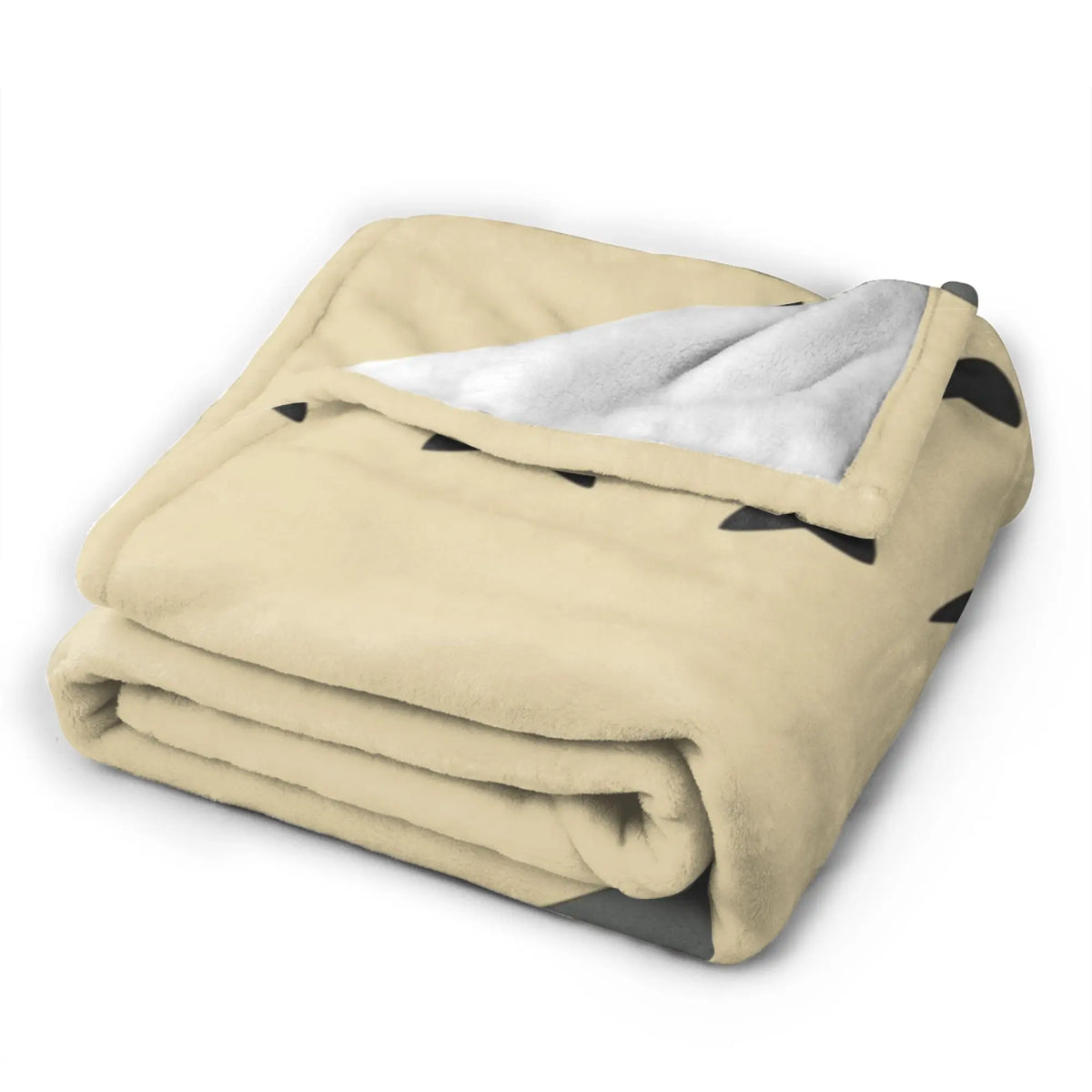 A tan fleece throw blanket featuring a Totoro character design, folded and displayed.