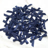 A pile of small navy blue satin ribbon bows for crafts and decor