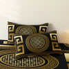 Black and gold geometric patterned pillow covers and duvet cover set