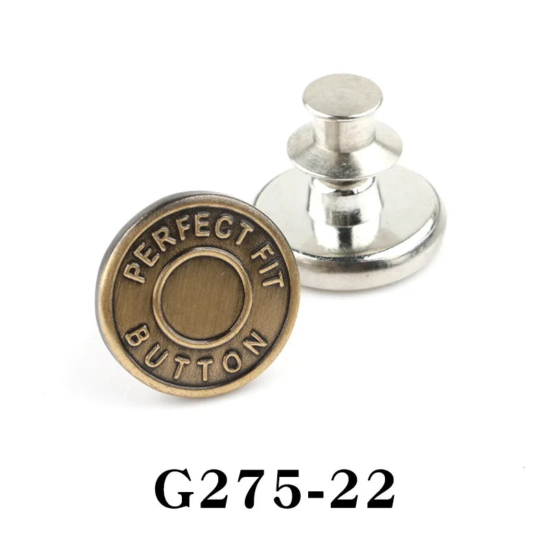 A round, brass-colored button pin with the text PERFECT FIT BUTTON engraved on it and a silver post.