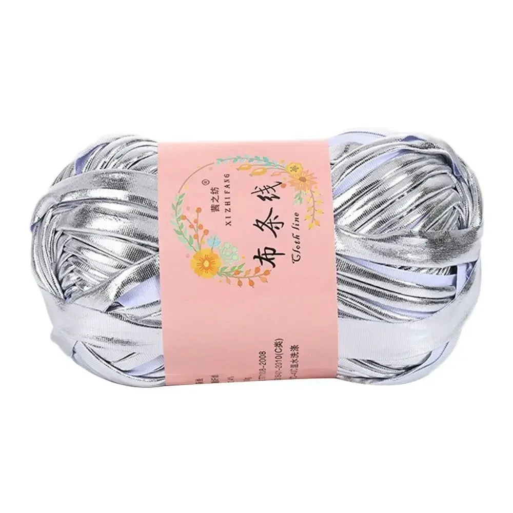 Spool of silver metallic ice rope crochet yarn for crafting