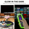 A hand holds a bright neon green glow-in-the-dark silicone remote cover against a dark background.