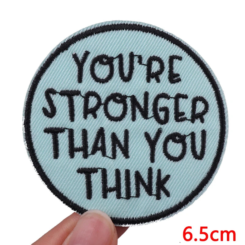 A light blue embroidered patch with the text You're stronger than you think.