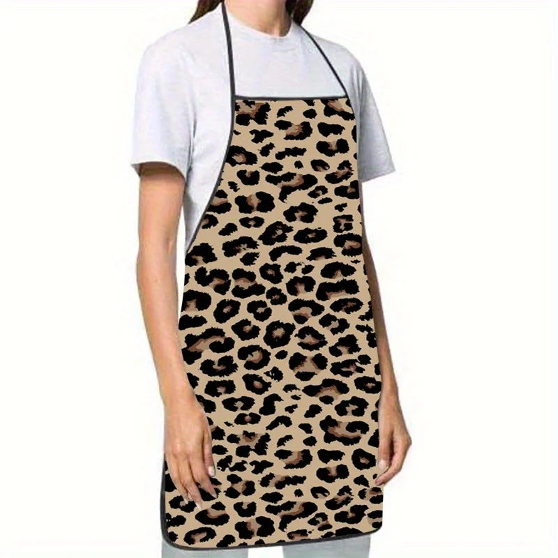 A woman wearing a sleeveless leopard print kitchen apron over a white t-shirt.