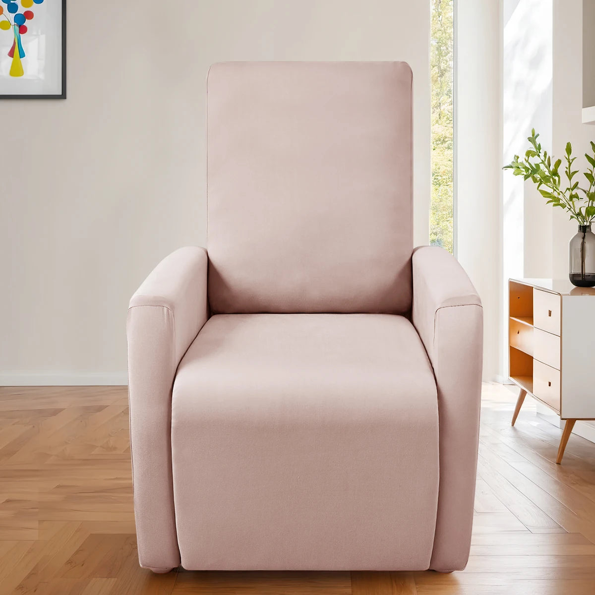 A light pink milk silk stretch sofa cover set for accent chairs displayed in a bright room.