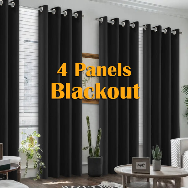 Four black blackout curtains hanging in a window frame.