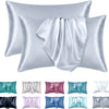 A set of satin pillowcases in various shades including silver, pink, blue, and green.