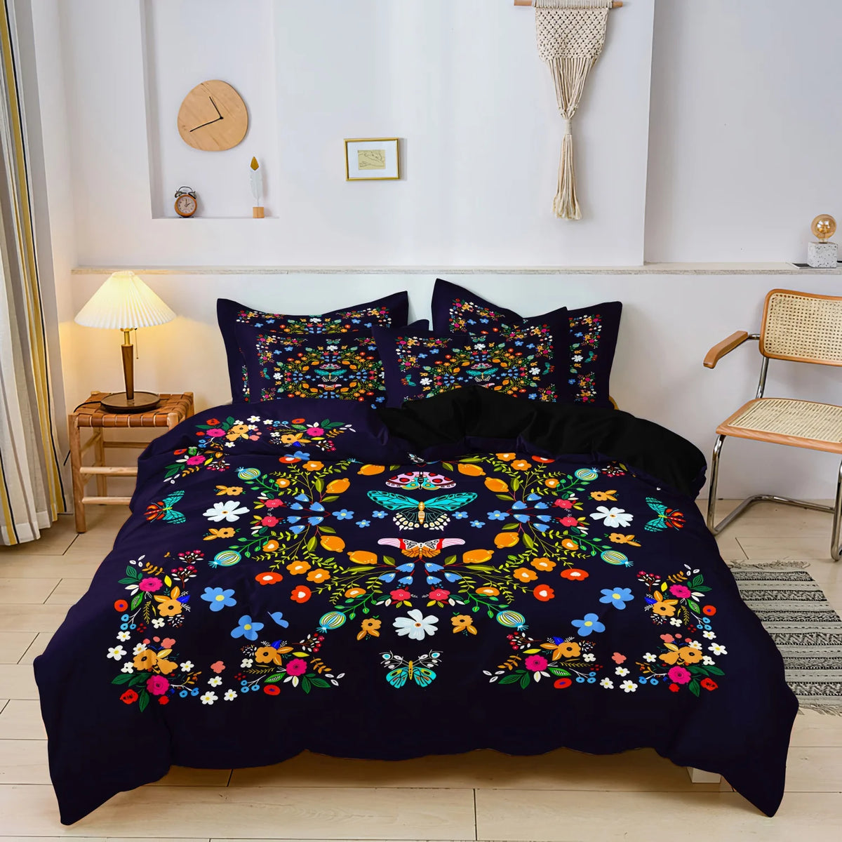 A dark blue duvet cover set featuring a colorful floral and butterfly print displayed on a bed.