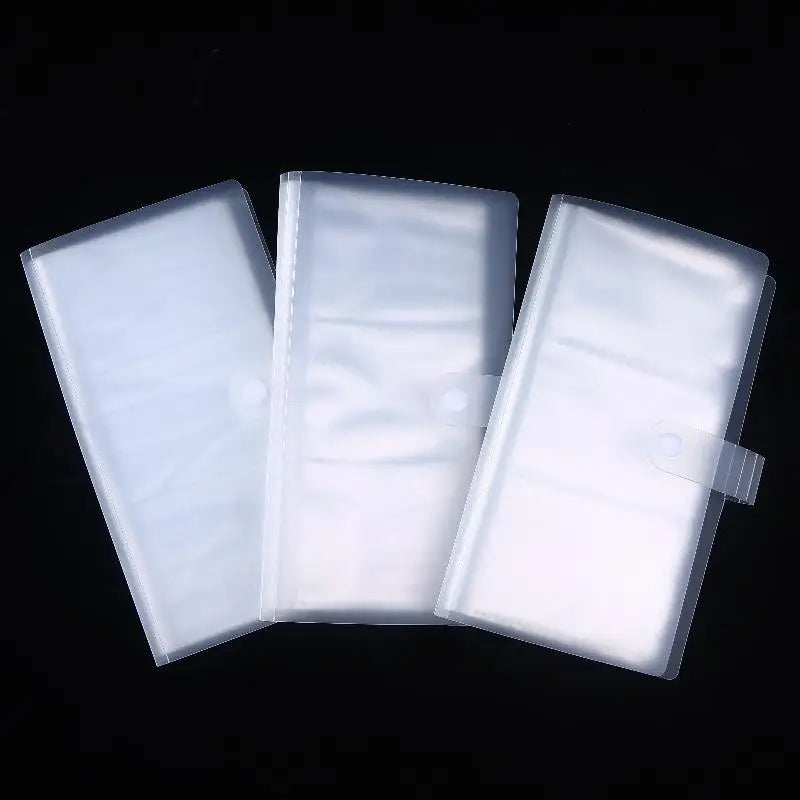 Three clear plastic photo storage cards arranged side by side against a black background.