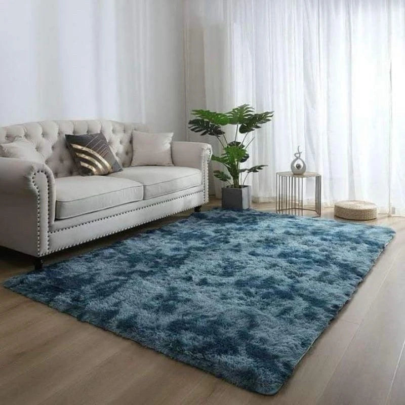 A deep blue velvet anti-slip floor mat placed on a light wood floor in a bright room.