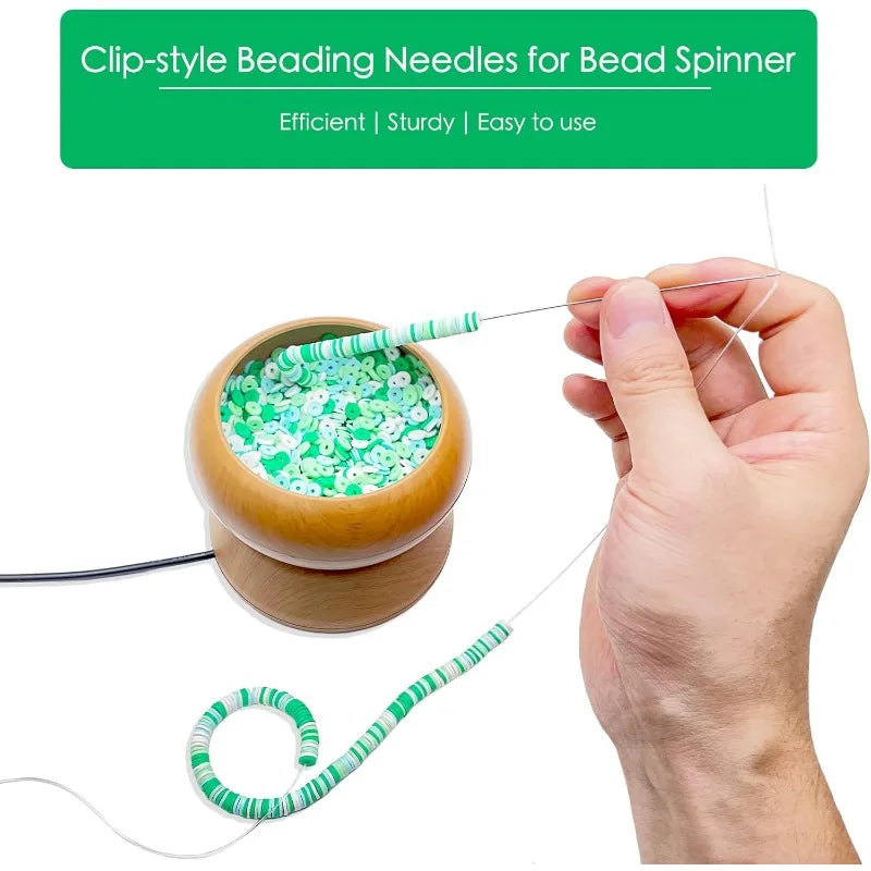 A hand is using a clip-style beading needle to thread a green bead spinner with a thin wire.