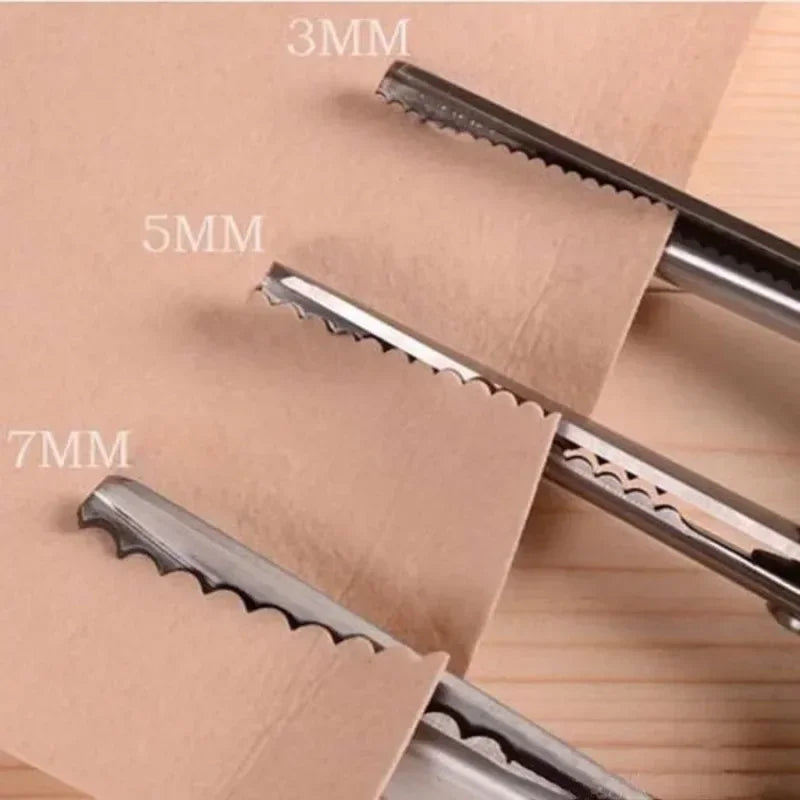 Close-up of professional dressmaking pinking shears with various blade sizes marked 3mm, 5mm, and 7mm on a beige paper backgr