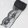 Black decorative lace ribbon roll with floral patterns and a black mesh band