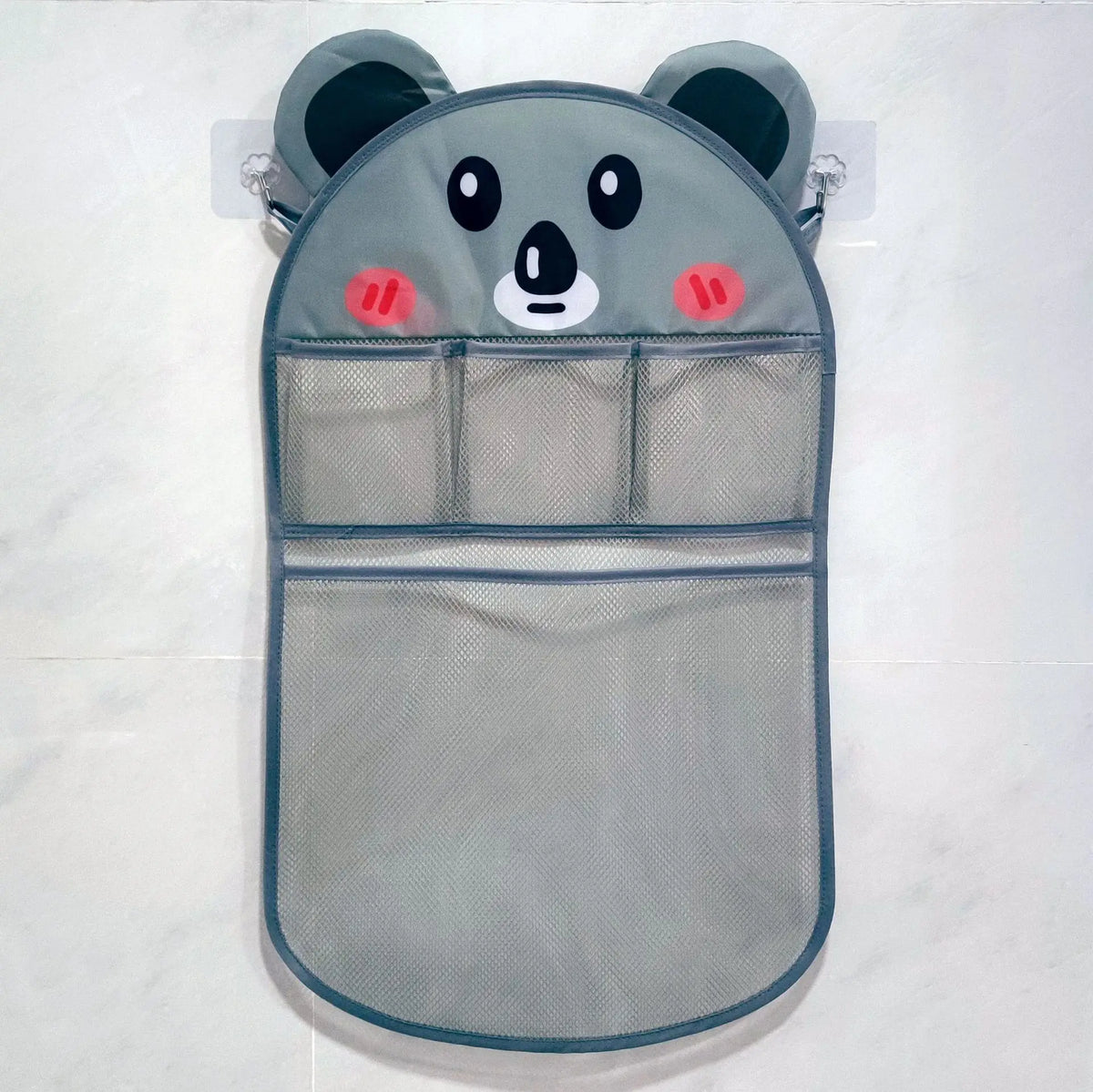 A gray mesh storage bag shaped like a panda face is displayed against a white background.